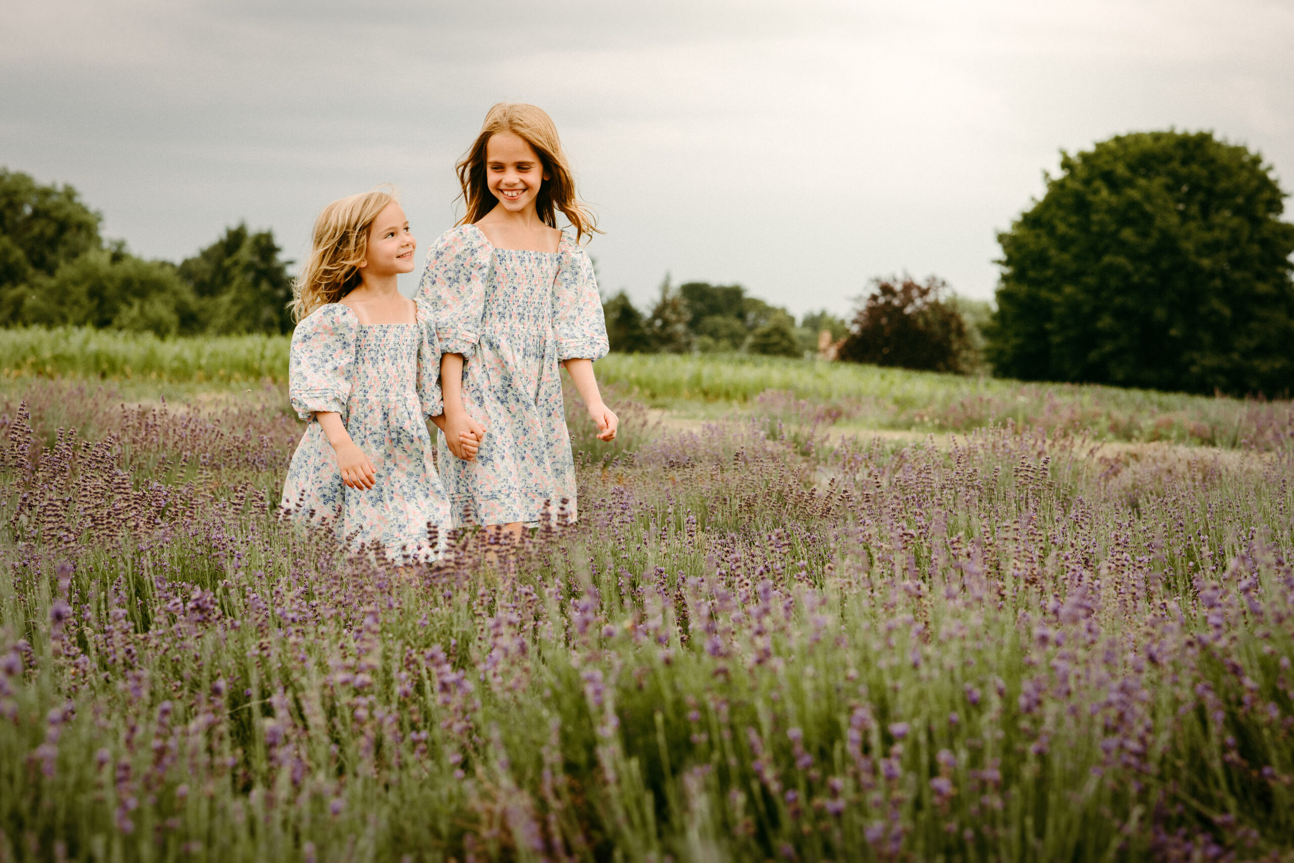 sisters family photos in lavender fields at Wickham Farms