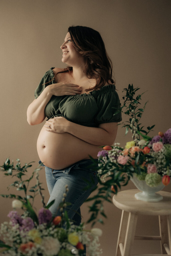 maternity photos in studio with flowers